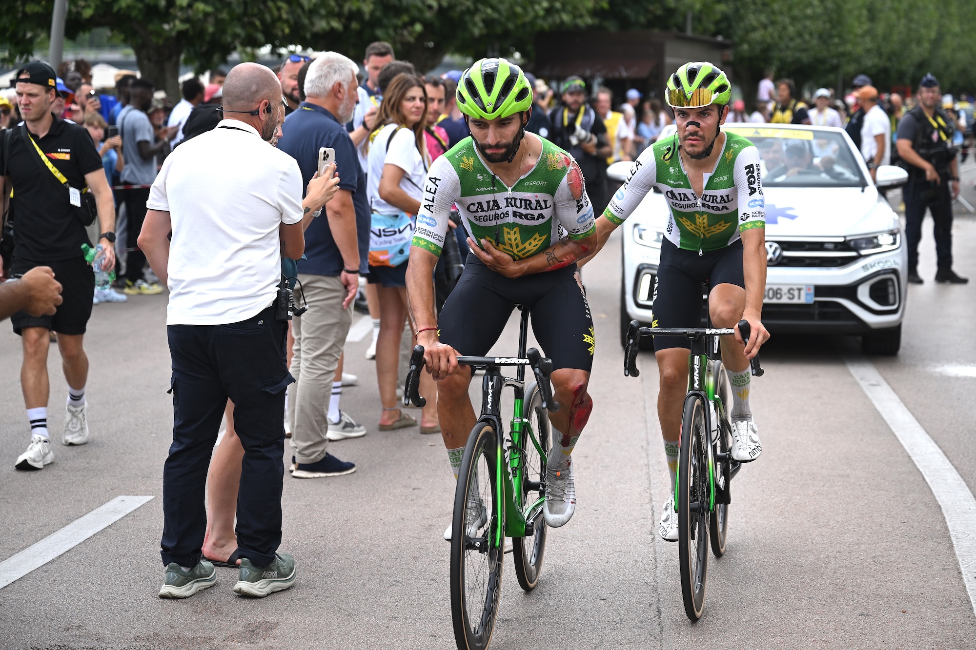 Fernando Gaviria of Colombia injured after with his teammate Stefano Oldani helping him finish