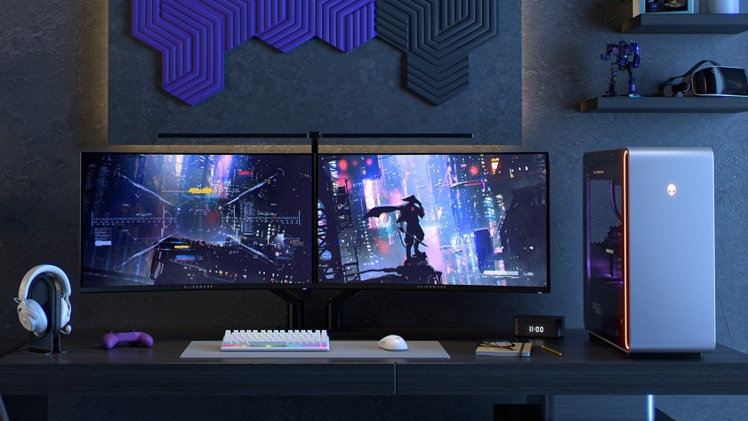 Alienware gaming setup with monitors, headset, gaming PC, keyboard, mouse
