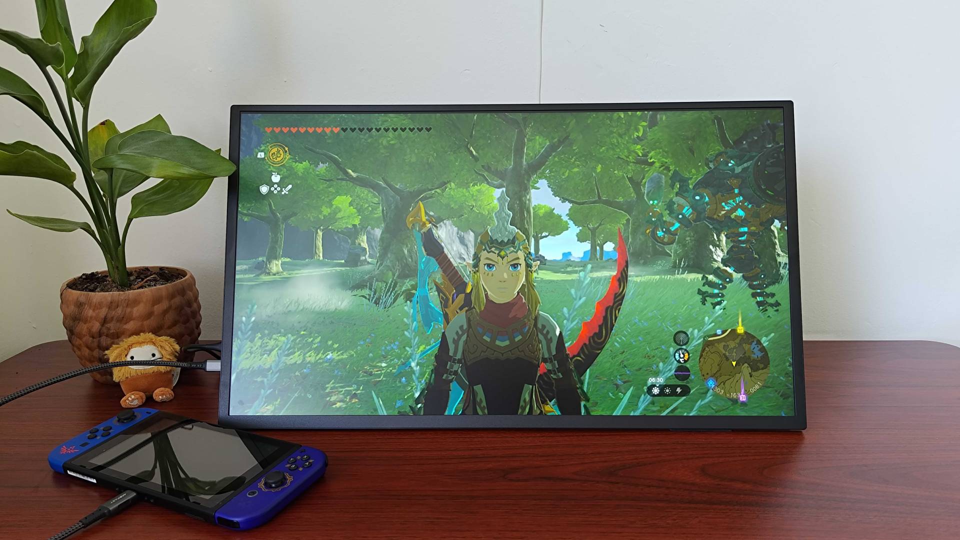 Uperfect Umax 24 portable monitor on desk with Nintendo Switch connected and Zelda: Tears of the Kingdom gameplay on screen.