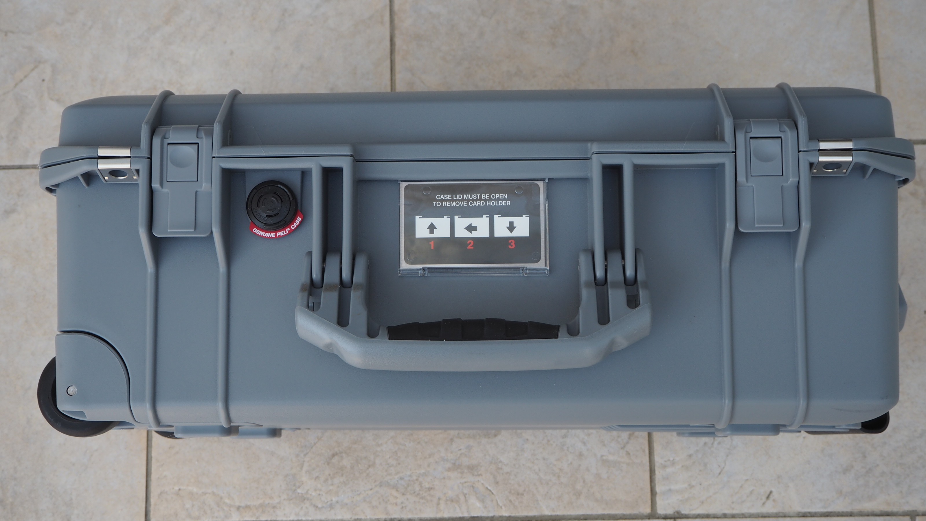 Peli 1535 Air case in grey on a flagstone floor