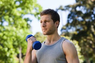 A man exercises in the park