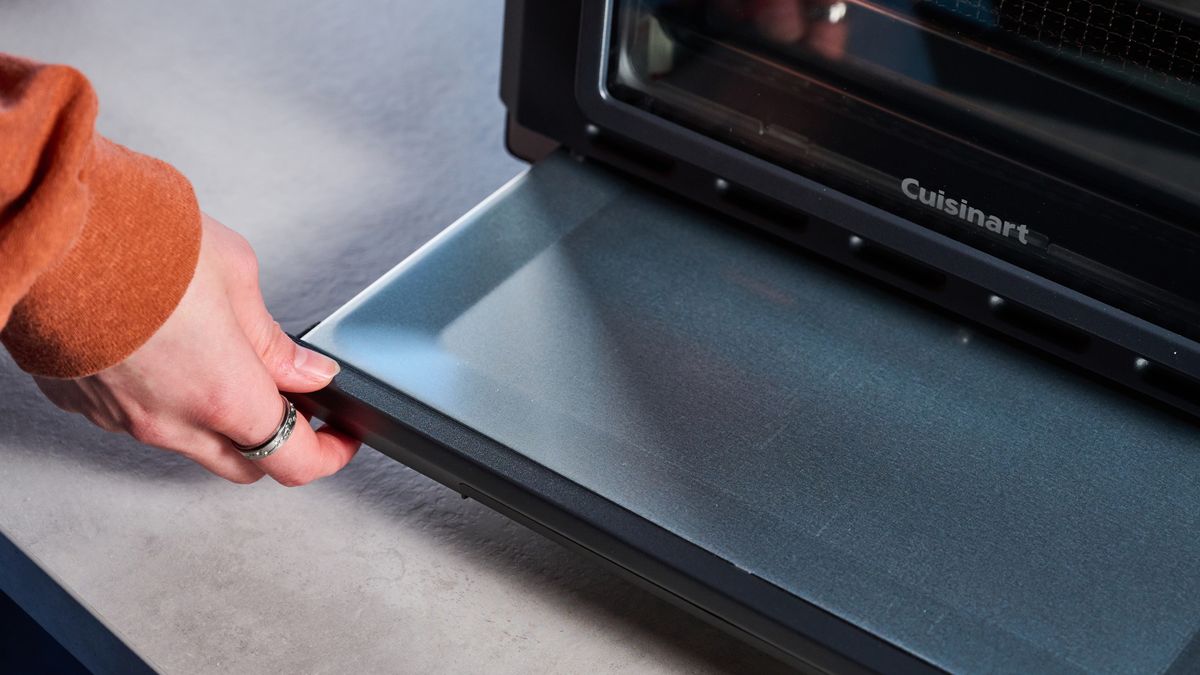 the cuisinart air fryer and toaster oven toa-60 with a black exterior, four temperature and timer dials