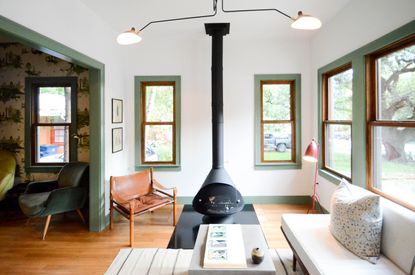 a retro inspired living room with painted boxes around the window