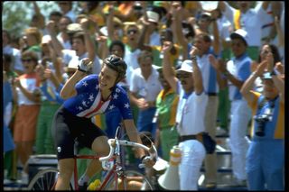 Rebecca Twigg raises her fist and smiles after crossing the line at the 1984 women's Olympic road race.