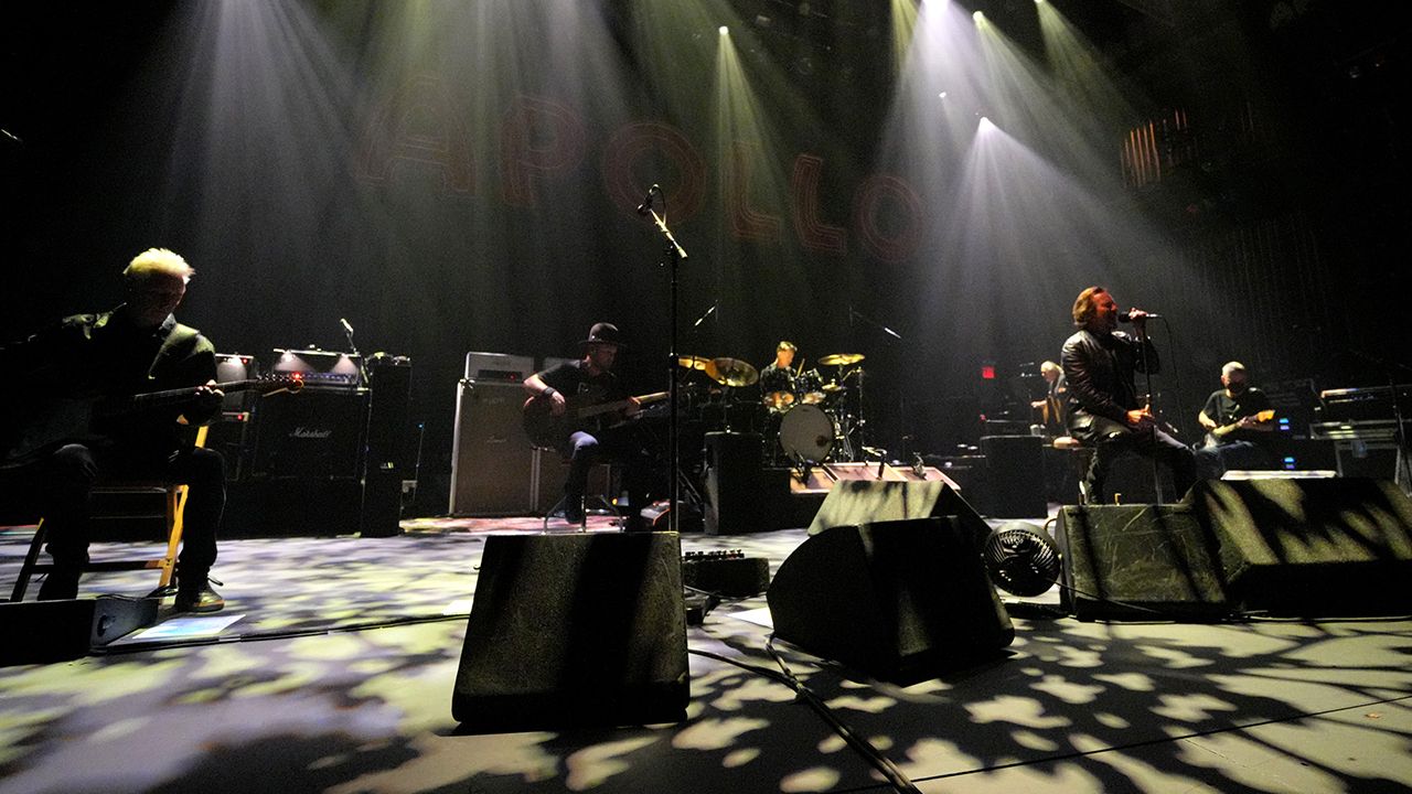 Pearl Jam play a seated number at the Apollo theater.