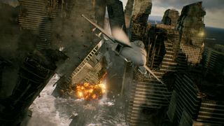 Best flight sims — a fighter jet races through a crumbling metropolis in Ace Combat 7.
