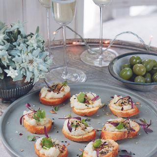 Canapes on a grey plate on side table