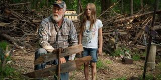 Pet Sematary Jud and Ellie standing in the middle of the burial ground