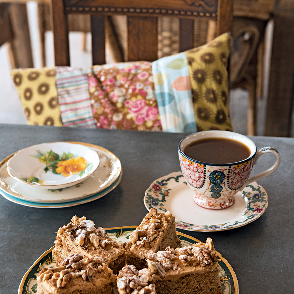 black coffee with pestries on grey table