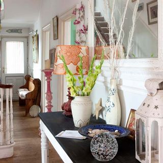 living room with wooden flooring and flower in white vase