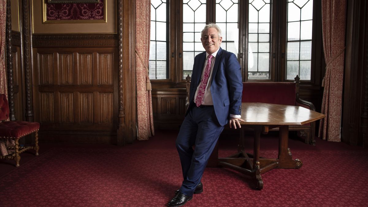 Former Speaker of the House John Bercow poses next to a desk in Parliament.