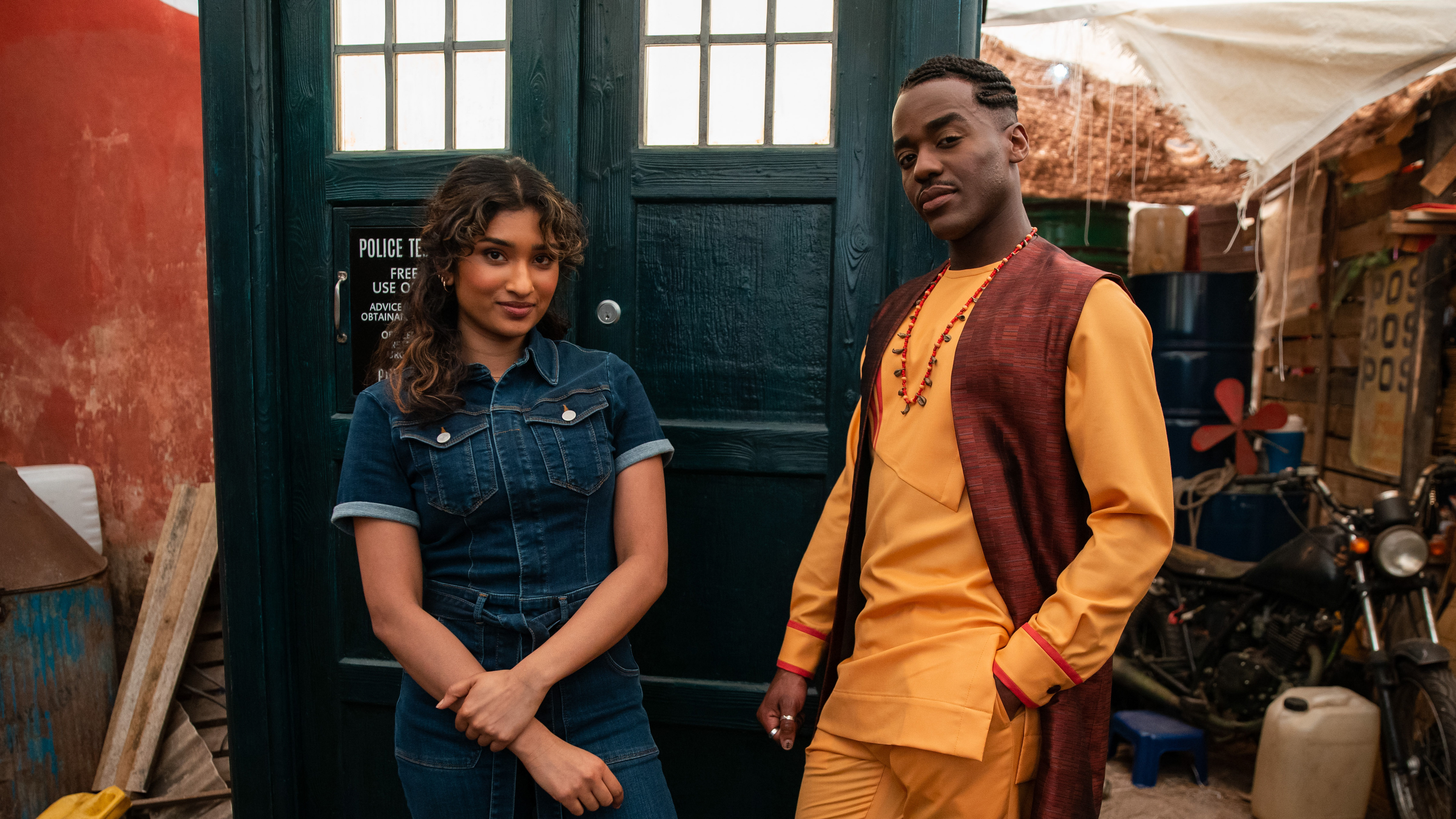 Varada Sethu as Belinda and Ncuti Gatwa as the Doctor next to the TARDIS in 'The Story & The Engine.'
