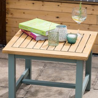 Garden coffee table with teal painted legs