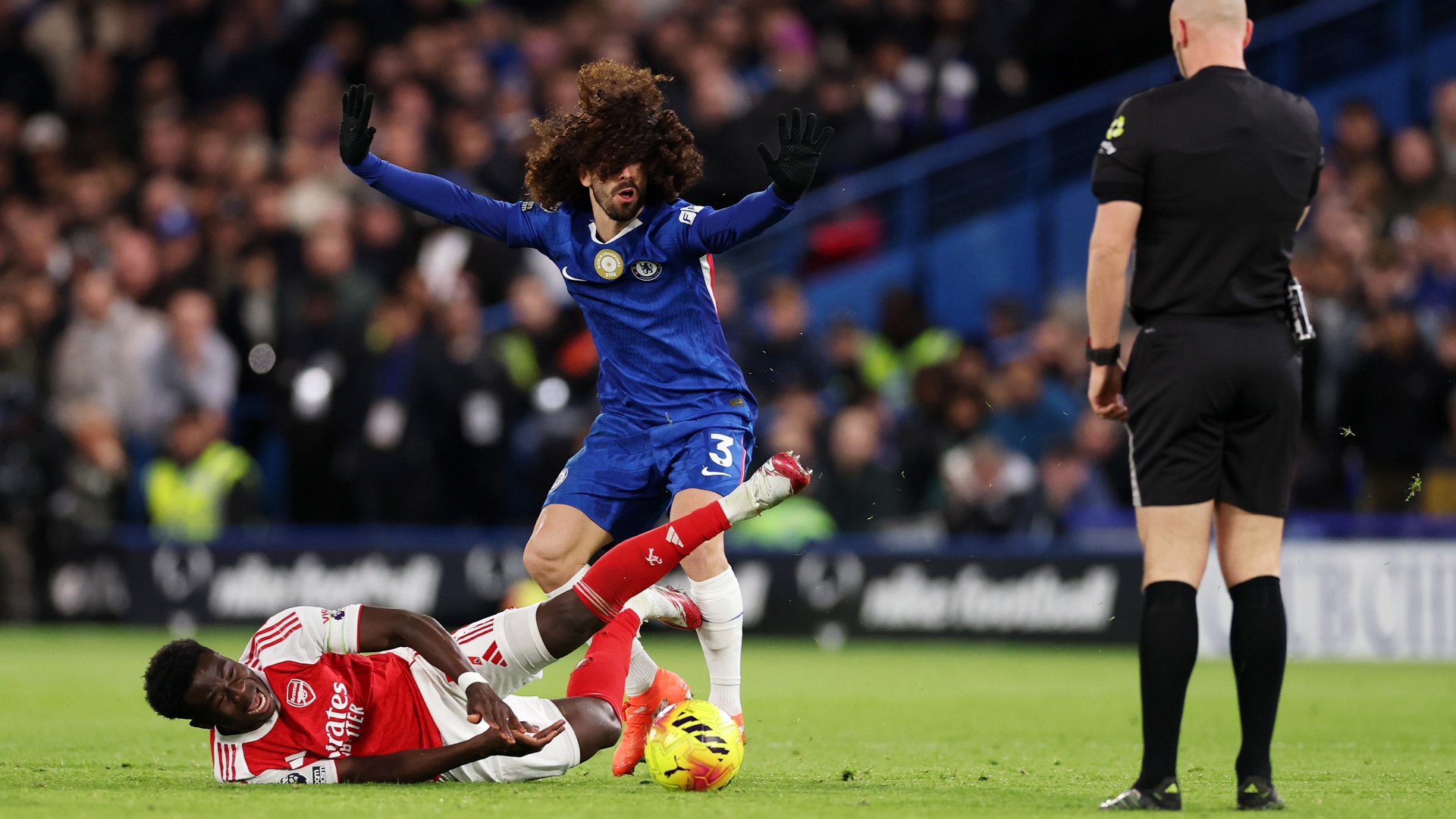 Marc Cucurella and Bukayo Saka collide during a recent Chelsea vs Arsenal game