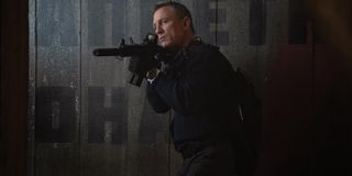 No Time To Die Daniel Craig in tactical gear, taking aim