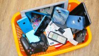  Phones and old tec in rubbish bin in Morden