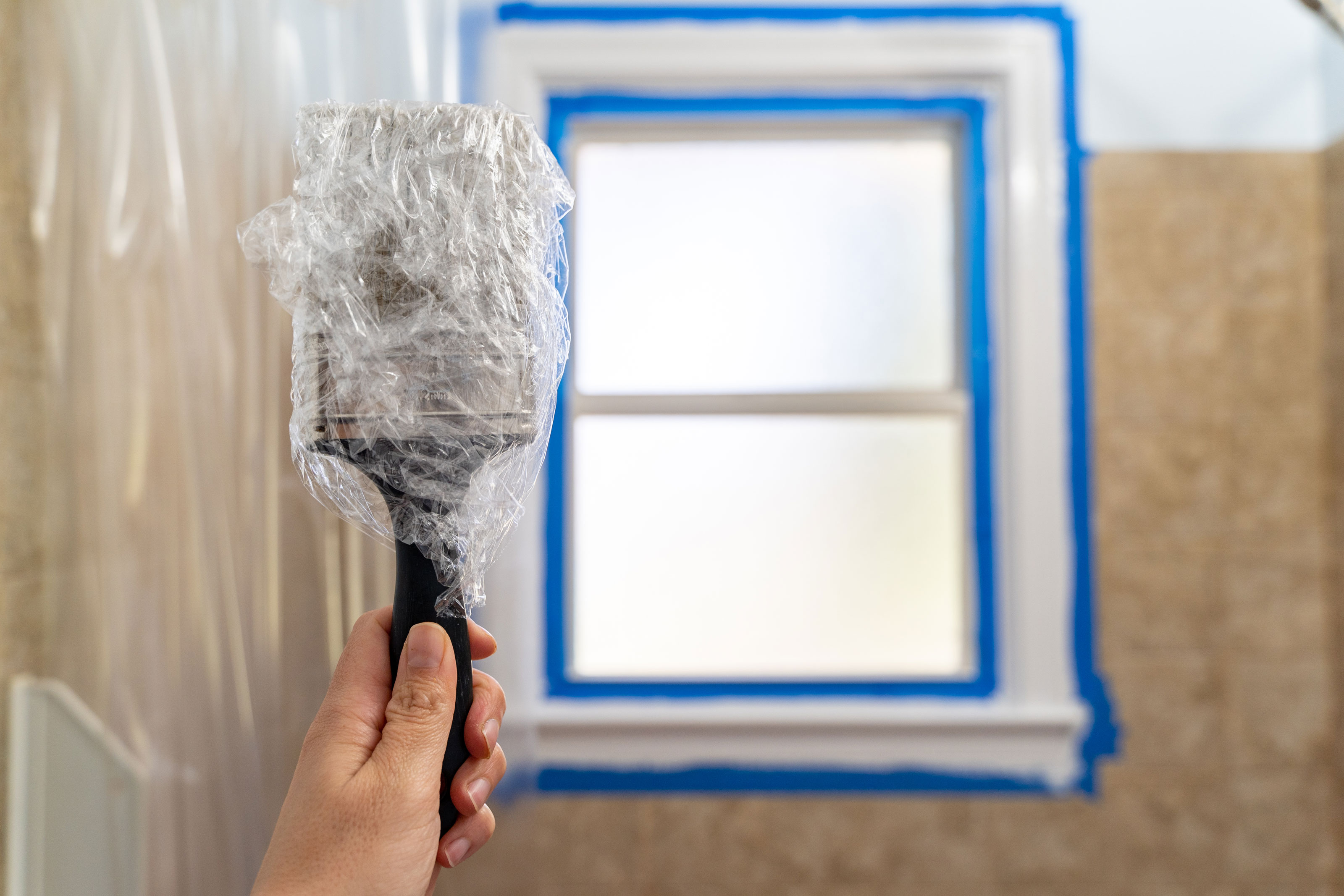 wrapping a paint brush in cling film
