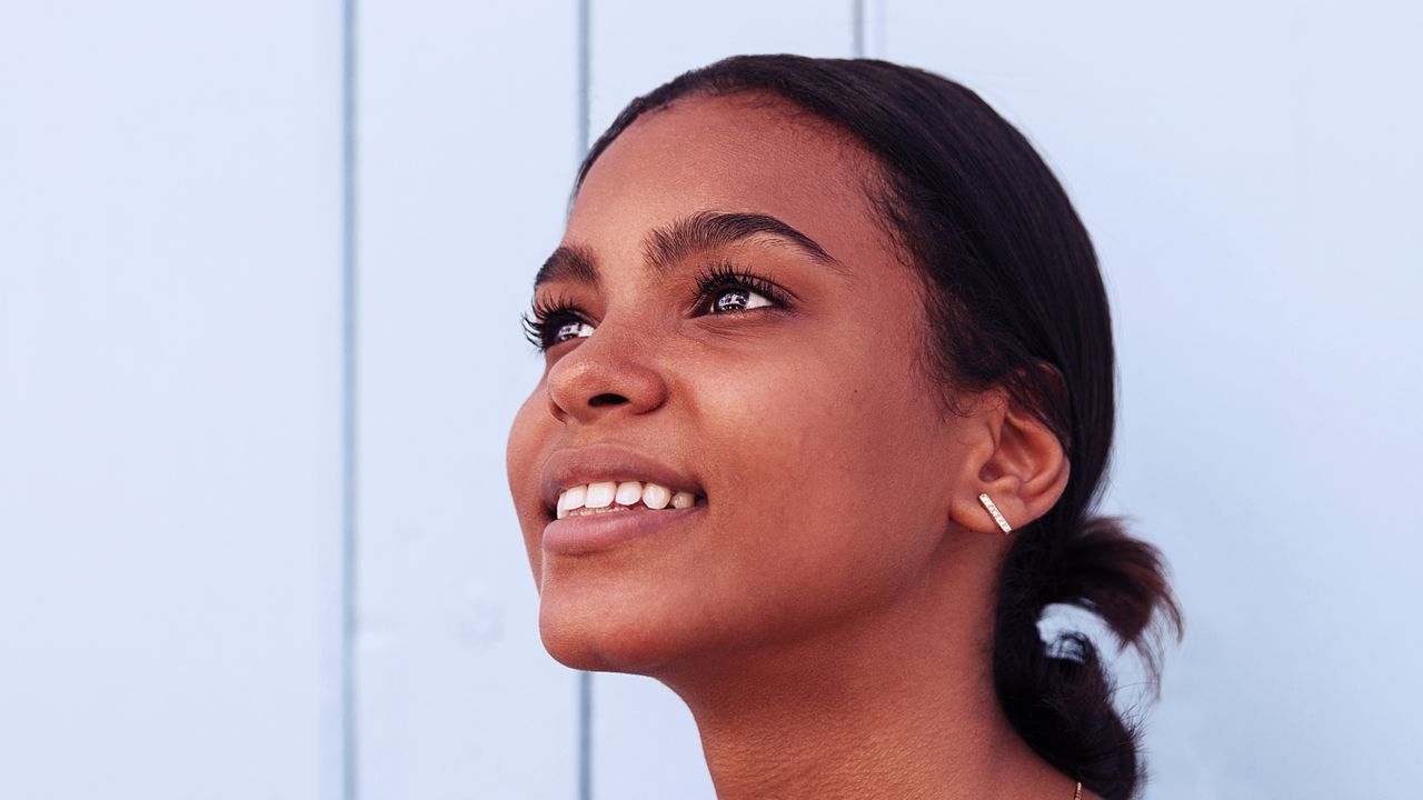 smiling young woman with groomed brows