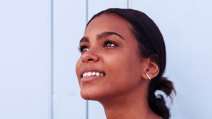 smiling young woman with groomed brows