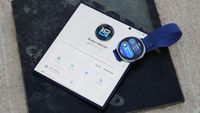The Samsung Galaxy Watch 8 next to the Samsung Wearable companion app.