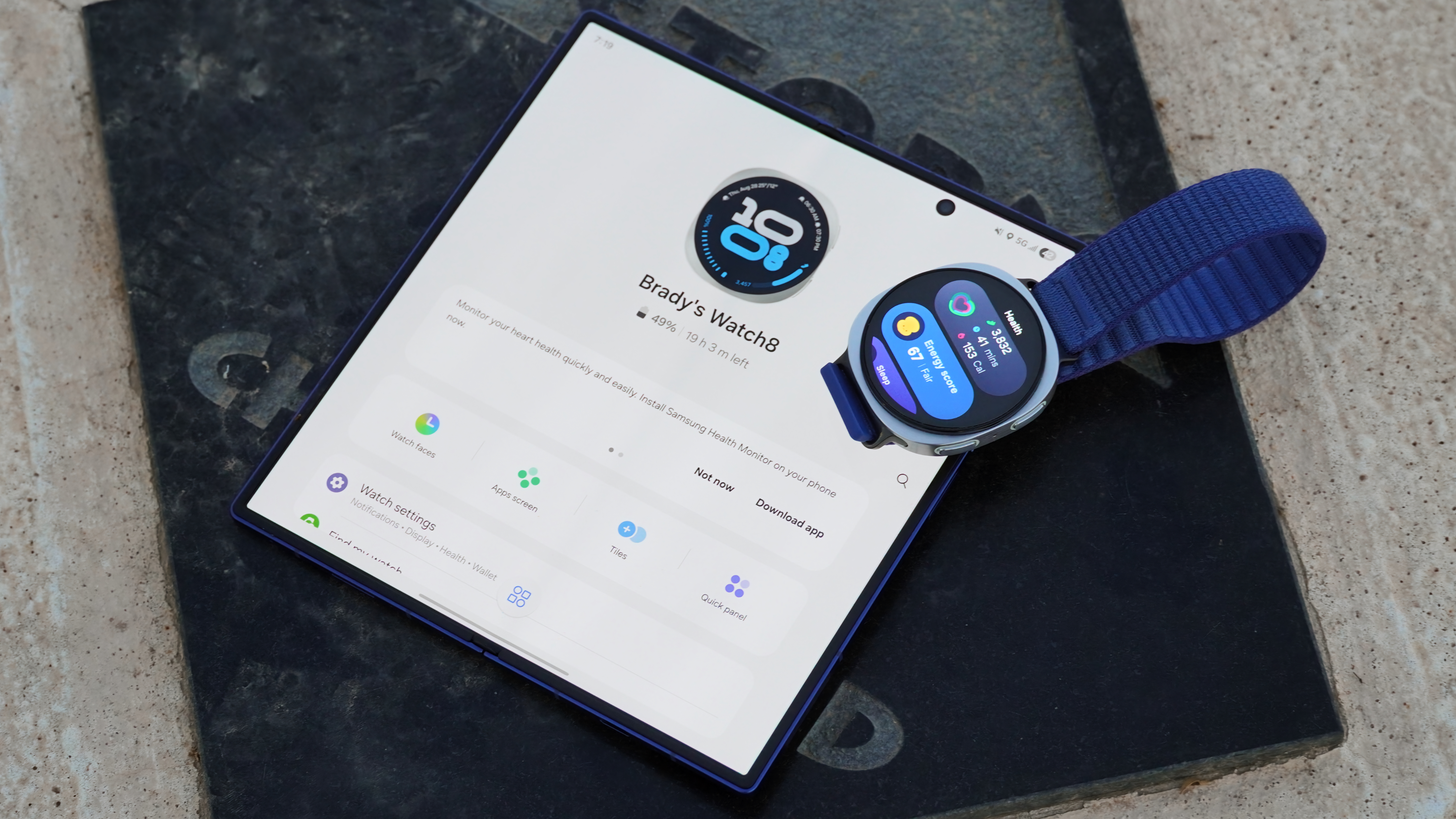 The Samsung Galaxy Watch 8 next to the Samsung Wearable companion app.