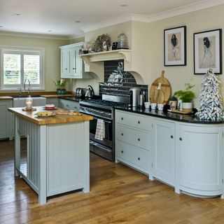 kitchen with wooden flooring and stainless steel range cooker