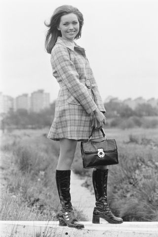 70s fashion - model with plaid and boots