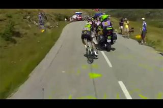 Ryder HEsjedal narrowly avoids being hit by a motorcycle on stage 18 of the 2015 Tour de France