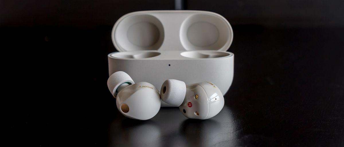 Sony WF-1000XM5 wireless earbuds in silver hero image.