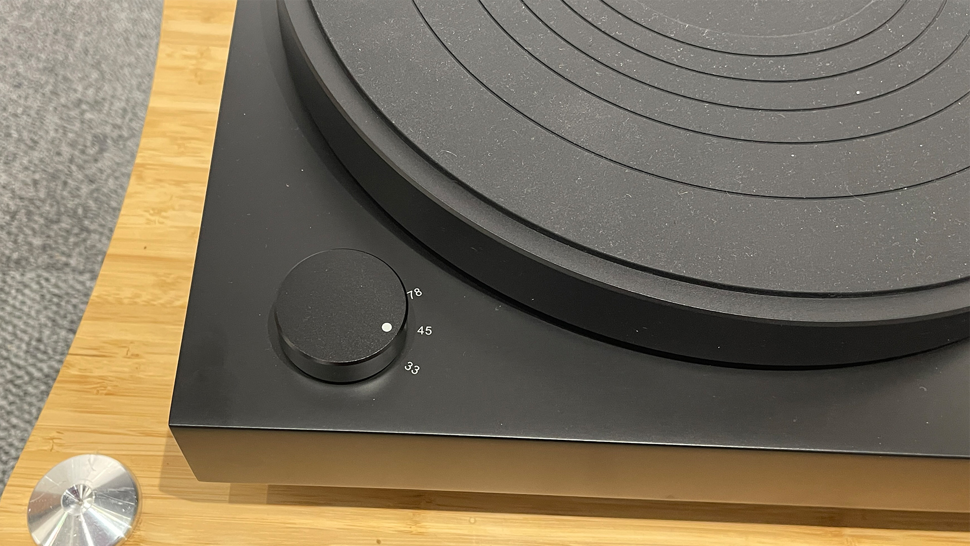 Audio-Technica AT-LP8X turntable detail of front left corner and speed control