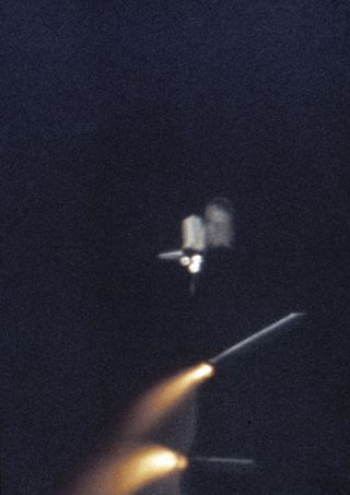 The twin solid rocket boosters separate from the external tank of NASA's space shuttle Columbia after its April 12, 1981 launch from Kennedy Space Center in Florida. Columbia's STS-1 mission was NASA's first manned mission since the Apollo-Soyuz Test Proj