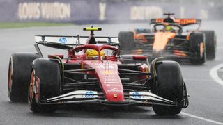 Lewis Hamilton of Ferrari leads McLaren's Oscar Piastri round a bend during the 2025 Australian Grand Prix