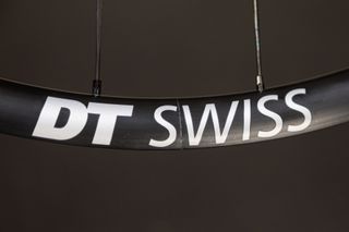 Close up of the DT Swiss branding on a black Dt Swiss rim