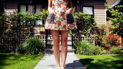 Young woman with purse in the street