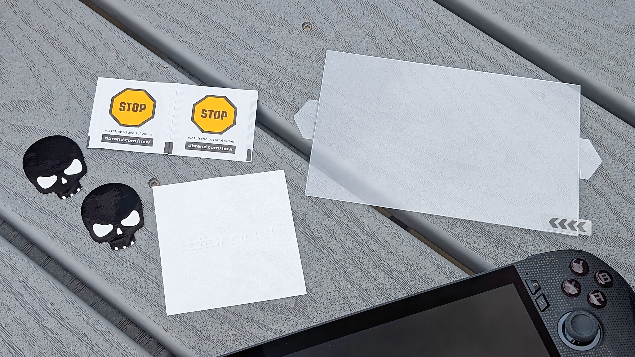 The stickers, microfiber towel, wipes, and glass screen protector that come with the Kilswitch.