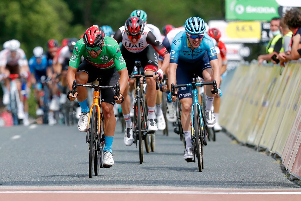 SAINT HAON LE VIEUXON FRANCE JUNE 01 Sonny Colbrelli of Italy and Team Bahrain Victorious Green Points Jersey stage winner celebrates at arrival Alex Aranburu Deba of Spain and Team Astana Premier Tech Brandon Mcnulty of United States and UAE Team Emirates during the 73rd Critrium du Dauphin 2021 Stage 3 a 1722km stage from Langeac to Saint Haon Le Vieuxon UCIworldtour Dauphin dauphine June 01 2021 in Saint Haon Le Vieuxon France Photo by Bas CzerwinskiGetty Images