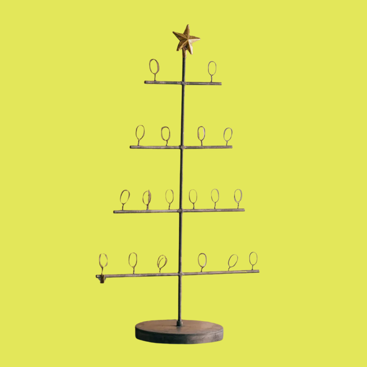 A metal Christmas tree card stand
