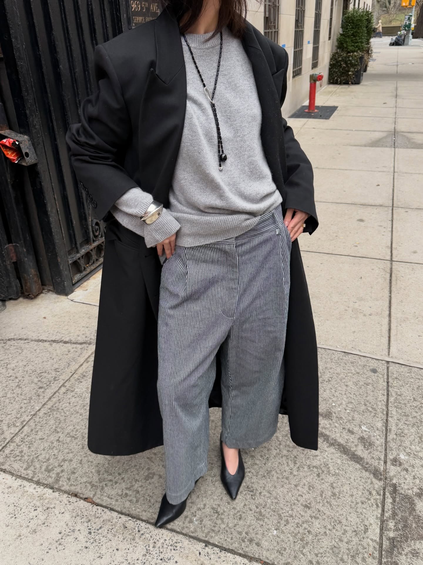 Creator @mimixn wearing a grey and black autumnal outfit