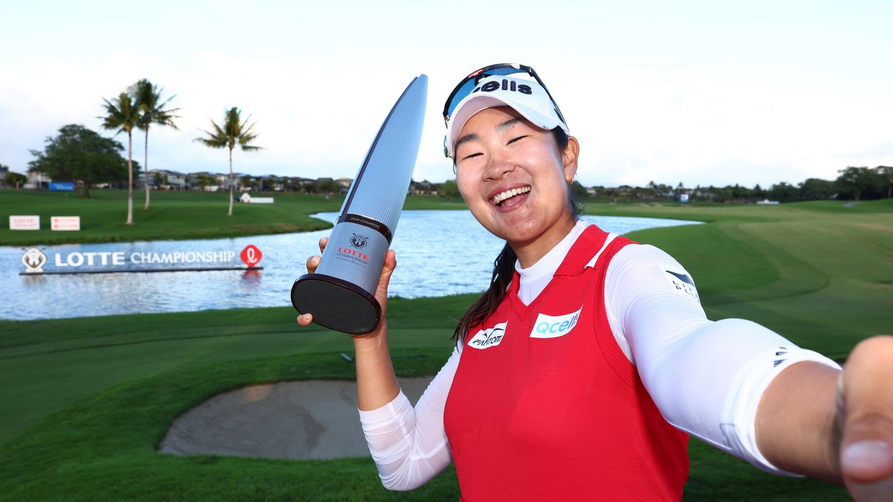 A Lim Kim takes a selfie with the 2024 Lotte Championship trophy after her two-stroke victory