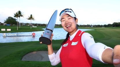 A Lim Kim takes a selfie with the 2024 Lotte Championship trophy after her two-stroke victory