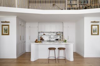 A white toned kitchen with a duplex level