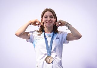 Ana Barbosu of Romania receives the bronze medal originally awarded to Jordan Chiles.