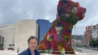 Monty Don stands in front of the Puppy statue in Bilbao in Monty Don's Spanish Gardens