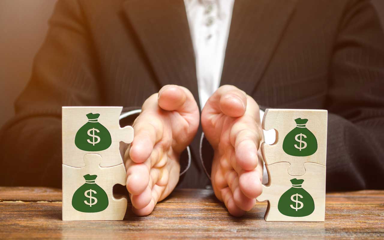 picture of man dividing blocks representing assets