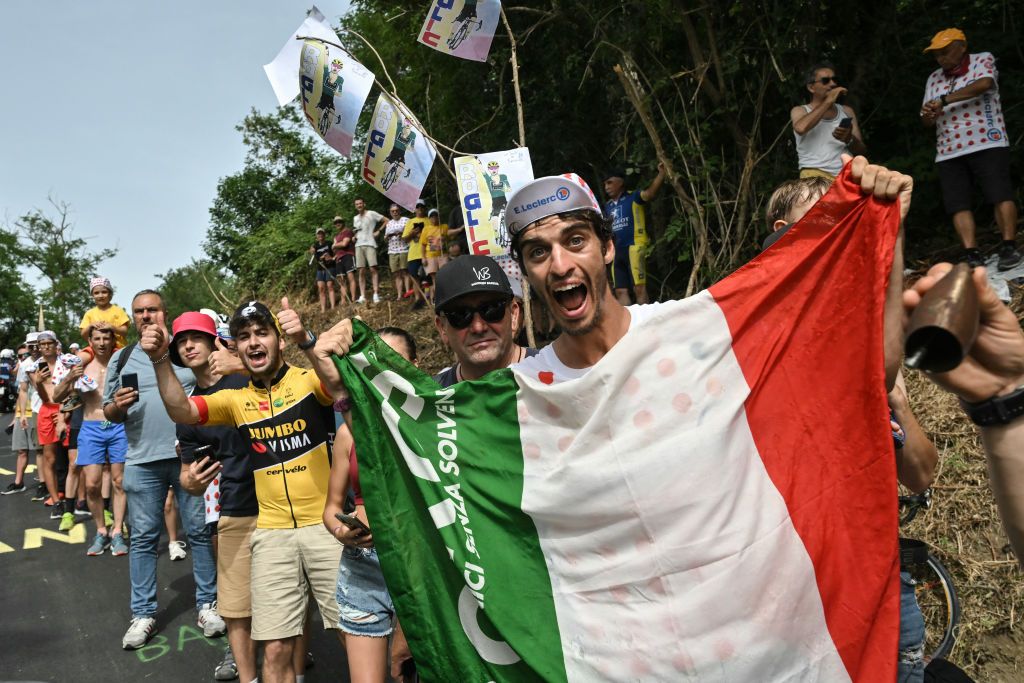 Spectators cheer along the roadside in the Barbotto ascent during the 1st stage of the 111th edition of the Tour de France cycling race, 206 km between Florence and Rimini, in Italy, on June 29, 2024. (Photo by Marco BERTORELLO / AFP)