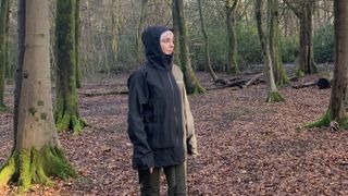 Julia Clarke wearing the Montane Solution Jacket in the forest