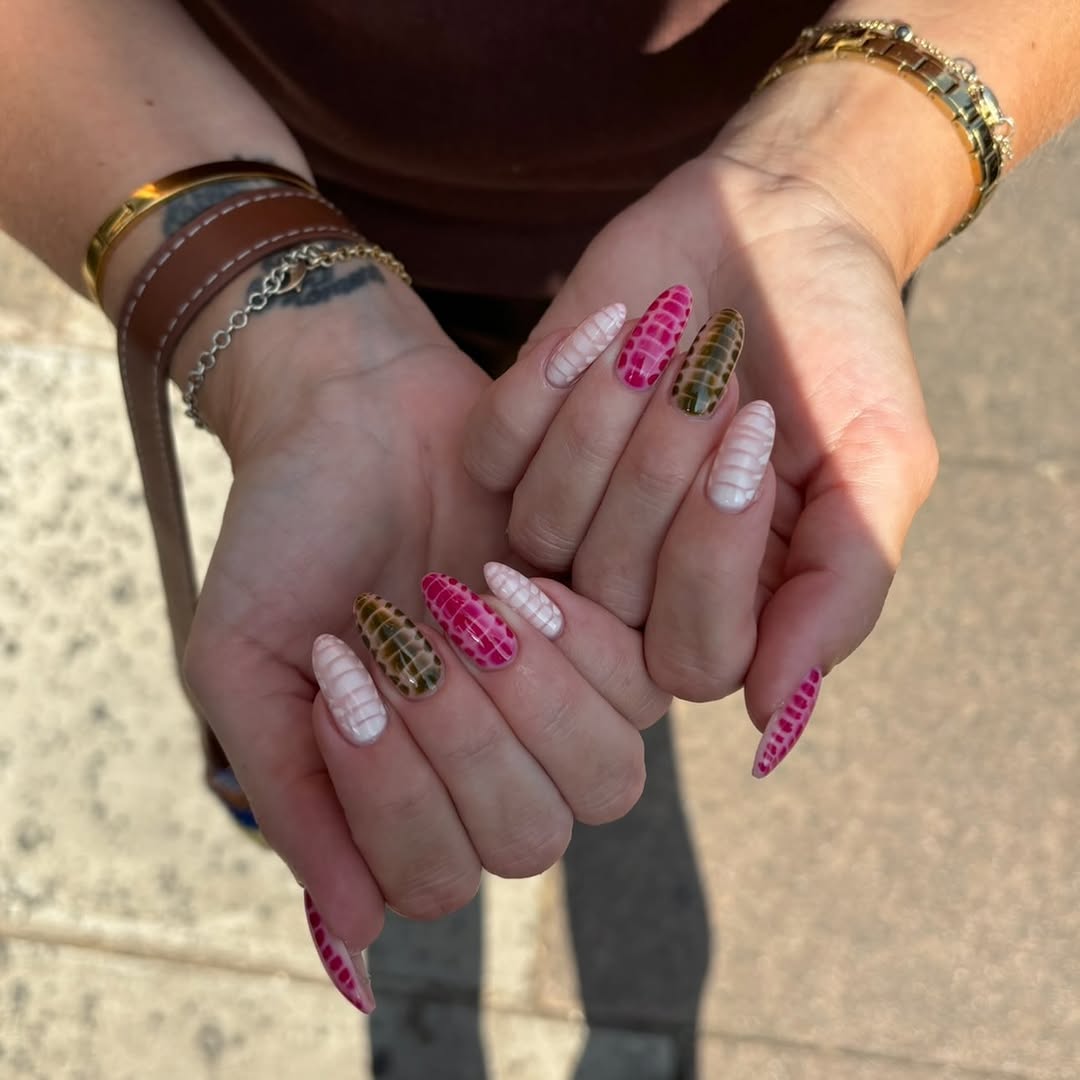 Mismatched almond nails with blooming croc texture in glossy hot pink, chocolate brown, and pearly white