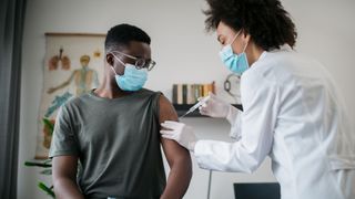 A man receiving a vaccine.