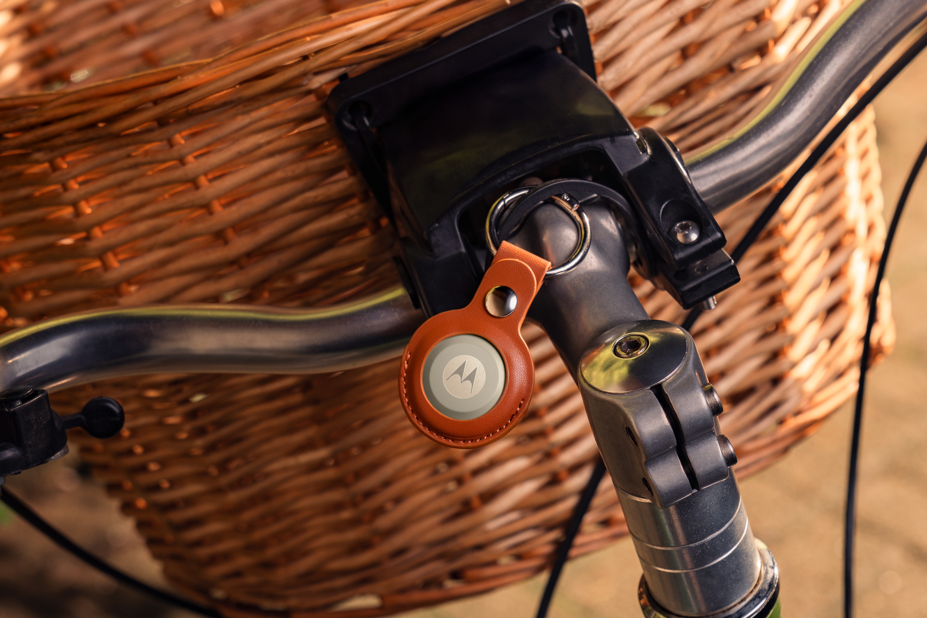 Moto Tag 2 dangling from a bicycle