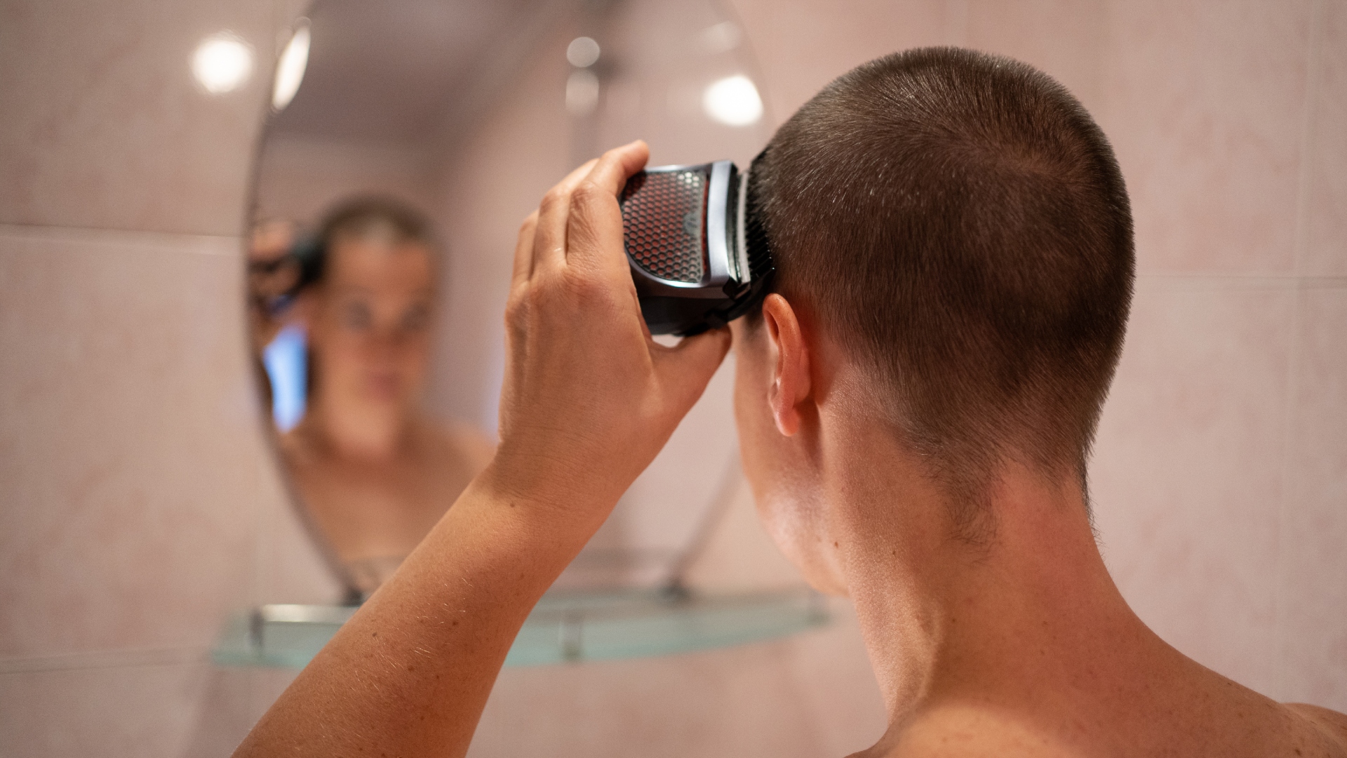 A woman shaving her head